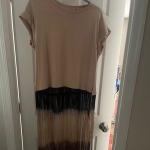 Short sleeved fringe top.  Can wear w/shorts or pants, as pictured